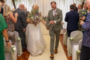 Bride and groom walking down the aisle
