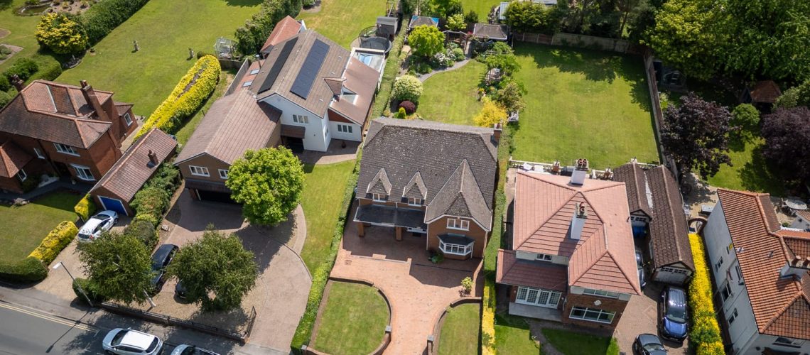 Aerial drone shot of detached house